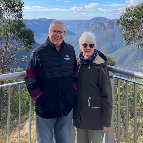 Max with partner smiling A KLM Financial Planners client, Max and his partner, smiling while travelling