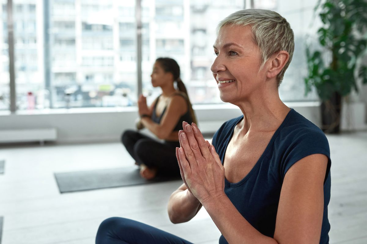 Woman doing yoga inside